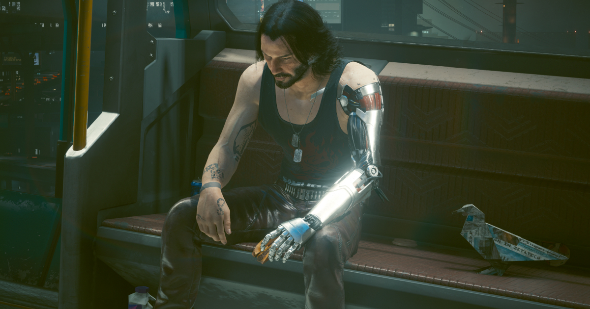 Grazie all'aggiornamento 2.1, Cyberpunk 2077 presenta un famoso meme con un Keanu Reeves triste. Grazie all'aggiornamento 2.1, Cyberpunk 2077 presenta un famoso meme con un Keanu Reeves triste.